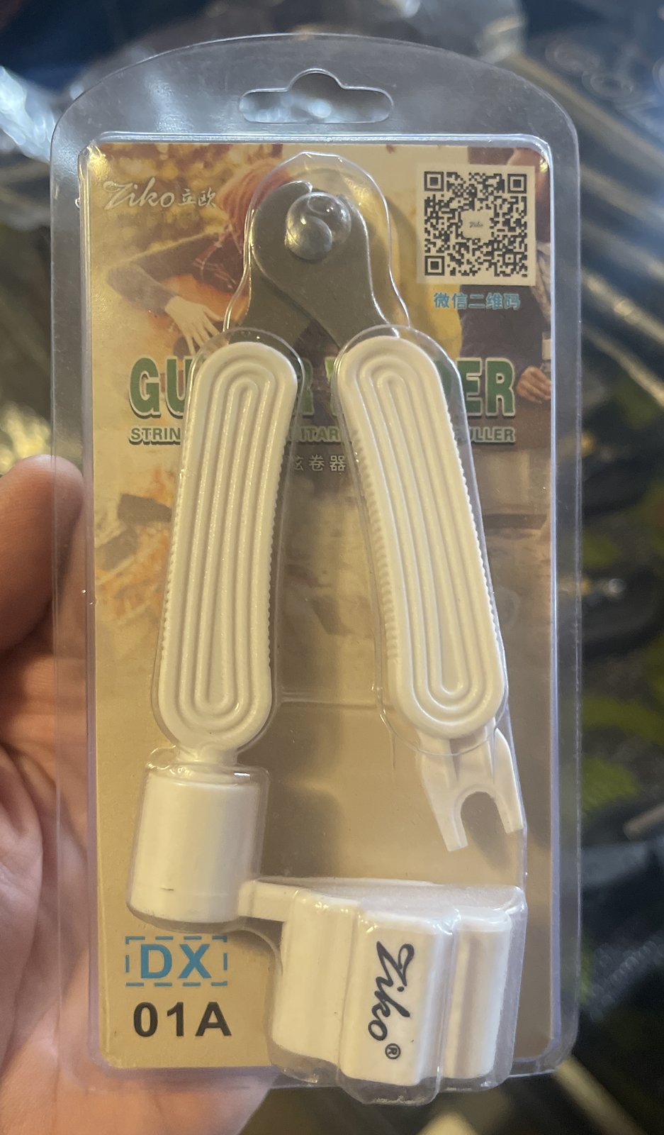 Ziko DX-01A white 3-in-1 string winder, cutter and bridge pin puller in packaging