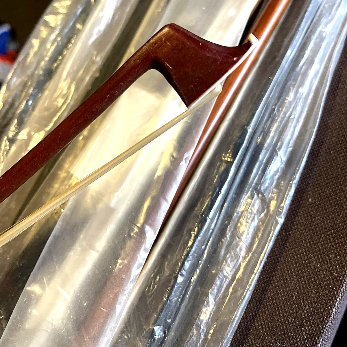 Cello bow tip and white hair