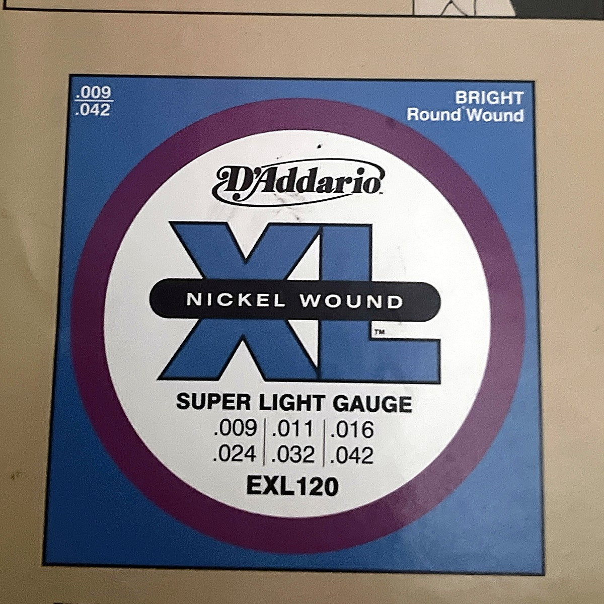 D'Addario EXL120 Super Light Nickel Wound electric strings packaging with gauge chart
